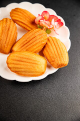 Madeleine cookies sweet dessert traditional french sweets tasty snack fresh delicious gourmet food background on the table rustic top view copy space