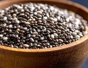 Close-up of chia seeds in wooden bowl