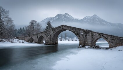 Fototapeta premium Snowy Mountain Winter Bridge Over Frozen Lake