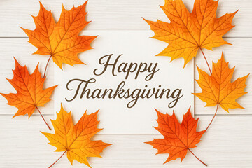 Flat lay greeting with the words “Happy Thanksgiving” written on white wood background, decorated with vibrant orange and yellow autumn maple leaves, symbolizing seasonal celebration, holiday greeting