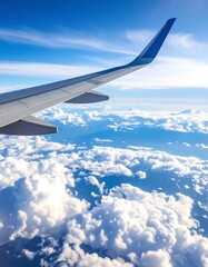 Obraz premium High-altitude view of a plane's wing and vast expanse of clouds. A breathtaking aerial perspective showcases the intricate details of the wing against a vibrant backdrop of cumulus clouds.