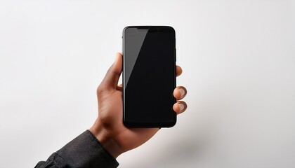 close up of a hand holding a black smartphone against a white background