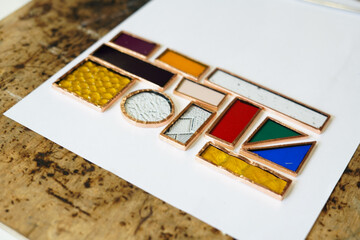 Naklejka premium Creative stained glass workshop. Close up 