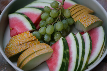 Fresh fruit on the plate. Close up. 