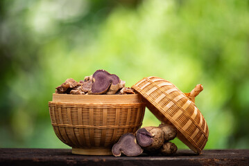 Fresh and dried slices with black galingale or kaempferia parviflora rhizomes on natural background.