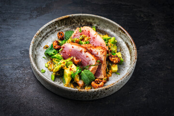 Tuna tataki steak with avacado, roasted cashew, chuka wakame and  maracuja passion fruit relish dip sauce