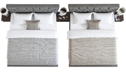 Overhead shot shows two beds. Each has pillows, bedding, and nightstands with lamps. Similar styles