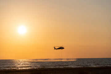Military helicopters filling 
sachet water dripping for fireworks