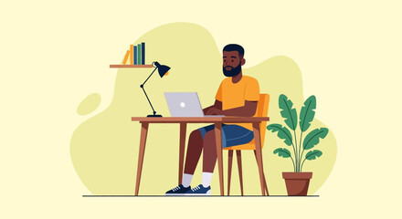 Focused Black man working remotely on his laptop at a minimalist home office desk with books and a plant. Represents productivity and modern freelance lifestyle.