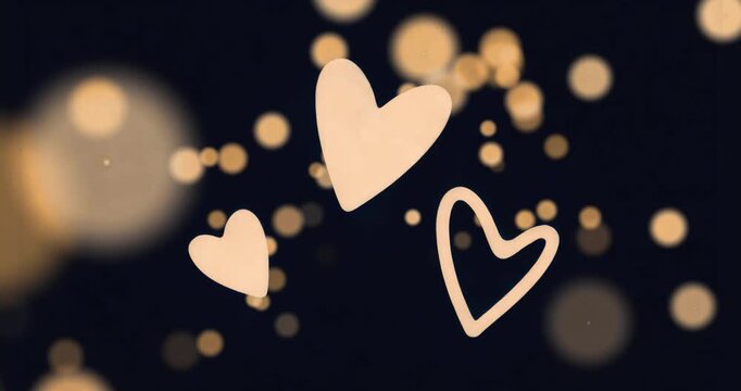 Upon starting three pale peach hearts floating upward pulsating among golden lights for looping