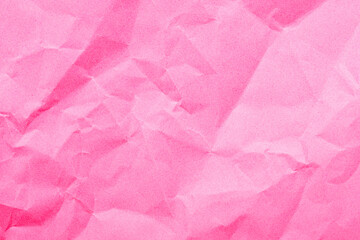 Textured pink crumpled paper background with soft tones