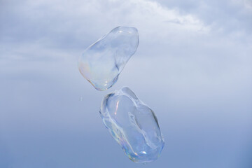 Huge bubble with blue sky and white cloud background