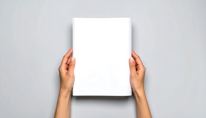 Blank magazine held by hands