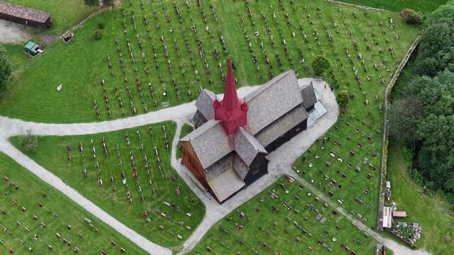 Drone view of Ringebu Stave Church, a striking wooden landmark set in Norway peaceful valley