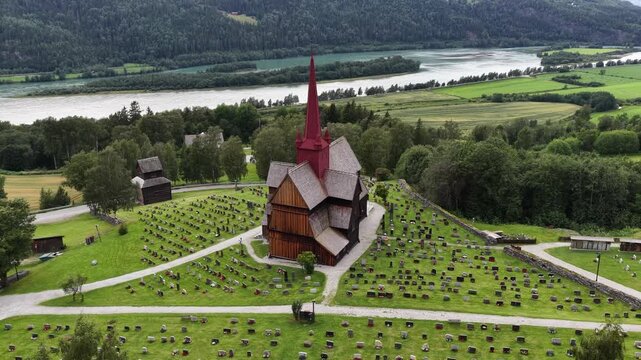 Green fields and winding rivers, Ringebu Stave Church rises like a quiet prayer to the northern sky