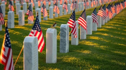 American flags placed on graves in a military cemetery for memorial day to honor veterans and remember their service