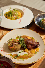 An Exquisite Gourmet Dish Featuring Chicken Accompanied by Flavorful and Colorful Garnishes