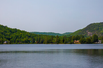 a beautiful view of a lake among the mountains on a summer day