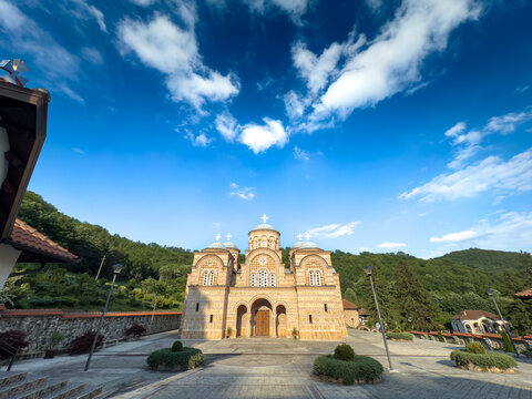 Front view of Nova Crkva Svetog Save at Celije Monastery, Serbia, its patterned brickwork and domes crowned with crosses; Manastir Celije is a serbian orthodox monastery..