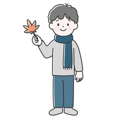 Obraz premium 紅葉を手に持っている男の子