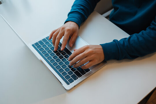 Typing on laptop keyboard for work from home productivity and remote office job success online now today - Powered by Adobe