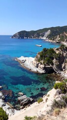 A breathtaking coastal view showcases a turquoise cove nestled amongst dramatic cliffs, bathed in sunlight.