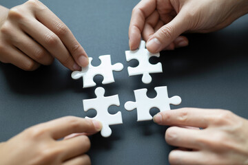 Connecting puzzle pieces teamwork concept business strategy solution collaboration partnership success jigsaw game