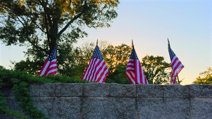 American flag in a row panning during sunset - Powered by Adobe
