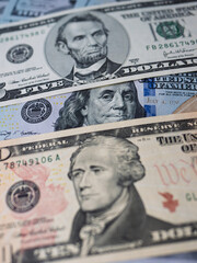 Close-Up of U.S. Currency Bills Featuring Portraits