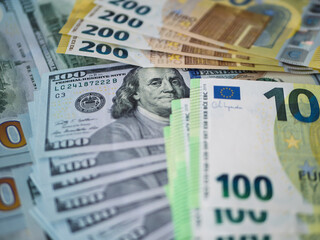 Fototapeta premium Assorted Currency Notes: 100 Euro and 200 Dollar Bills