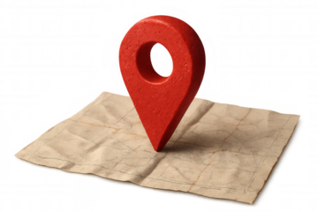 Location pin marking red wooden surface atop weathered paper map, symbolizing travel navigation against transparent backdrop
