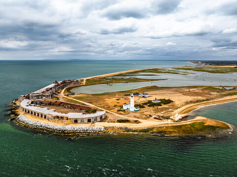 Hurst Point Lighthouse and Hurst Castle from drone over Hurst Spit, Milford on Sea, Lymington, Hampshire, England	