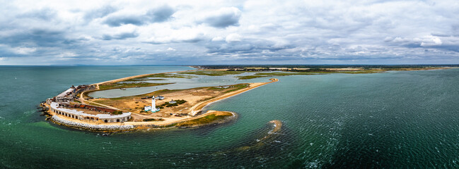 Panorama of Hurst Point Lighthouse and Hurst Castle from drone over Hurst Spit, Milford on Sea,...