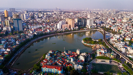 Fototapeta premium Train tracks suspended above Hanoi lake waters