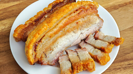 Crispy fried pork on white plate