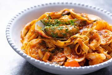 italian seafood pasta in tomato sauce