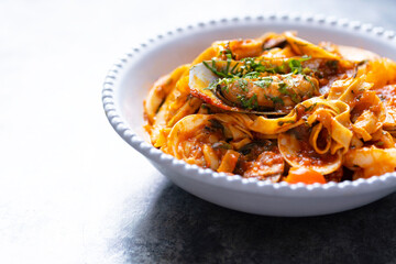 italian seafood pasta in tomato sauce