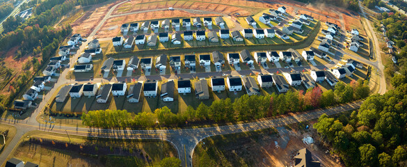 Aerial view of tightly located new family houses in South Carolina suburban area. Real estate...