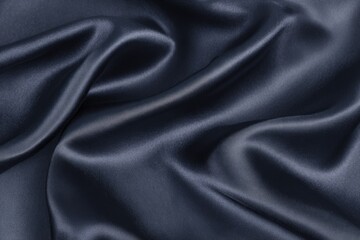 Dark gray silk fabric with flowing, draped folds