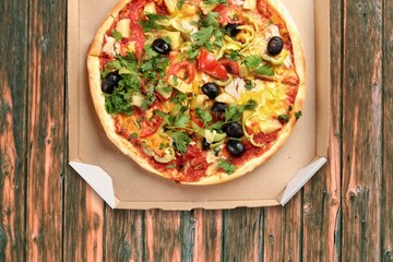 Delicious tasty fresh pizza on wooden table
