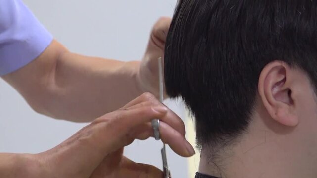 A person getting a haircut indoors