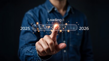 Businessman s finger touching a futuristic progress bar indicating the transition from 2025 to 2026 with glowing lights and a loading symbol