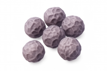 Dried peppercorns clustered, displaying deep purple and gray tones with intricate surface textures against translucent backdrop