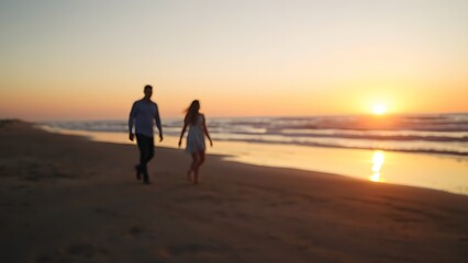 Sunset at the beach with golden light and distant silhouettes of a family.