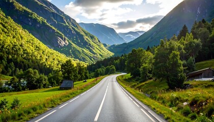 Naklejka premium Scenic mountain road winding through lush valley (1)