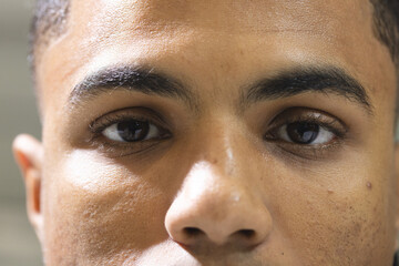 African american man gazing into camera in studio portrait with lighting capturing skin detail