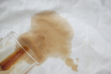 Coffee spills on a white kitchen cloth