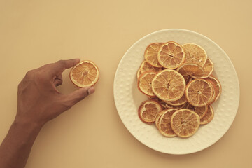 Sliced dried citrus fruits arranged on a plate