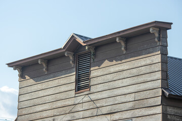 Roof and attic vent on a wooden building