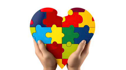 hand holding a heart shape colorful puzzle pieces on white background